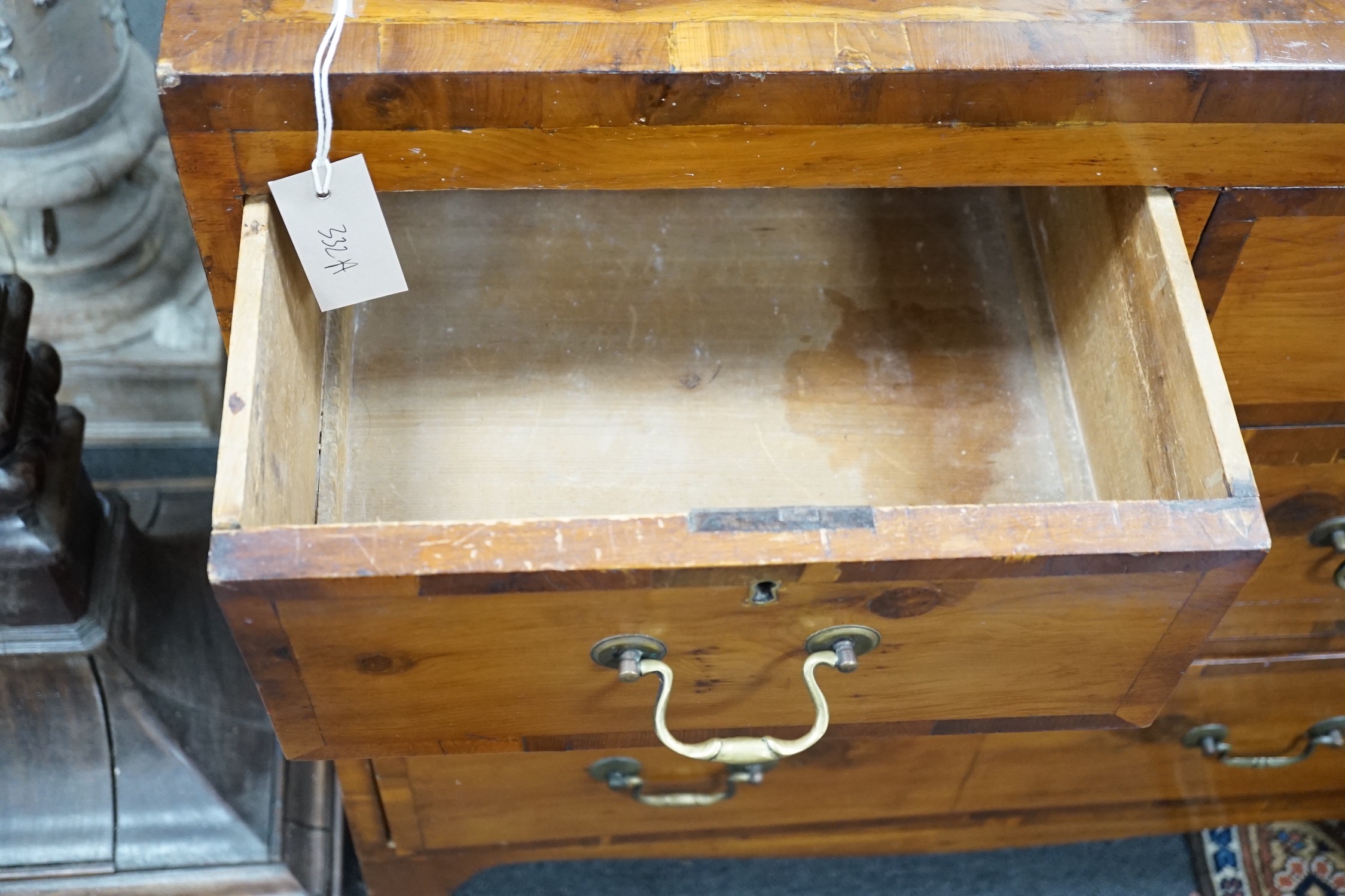 A modern Georgian style yew veneered chest, width 78cm *Please note the sale commences at 9am.